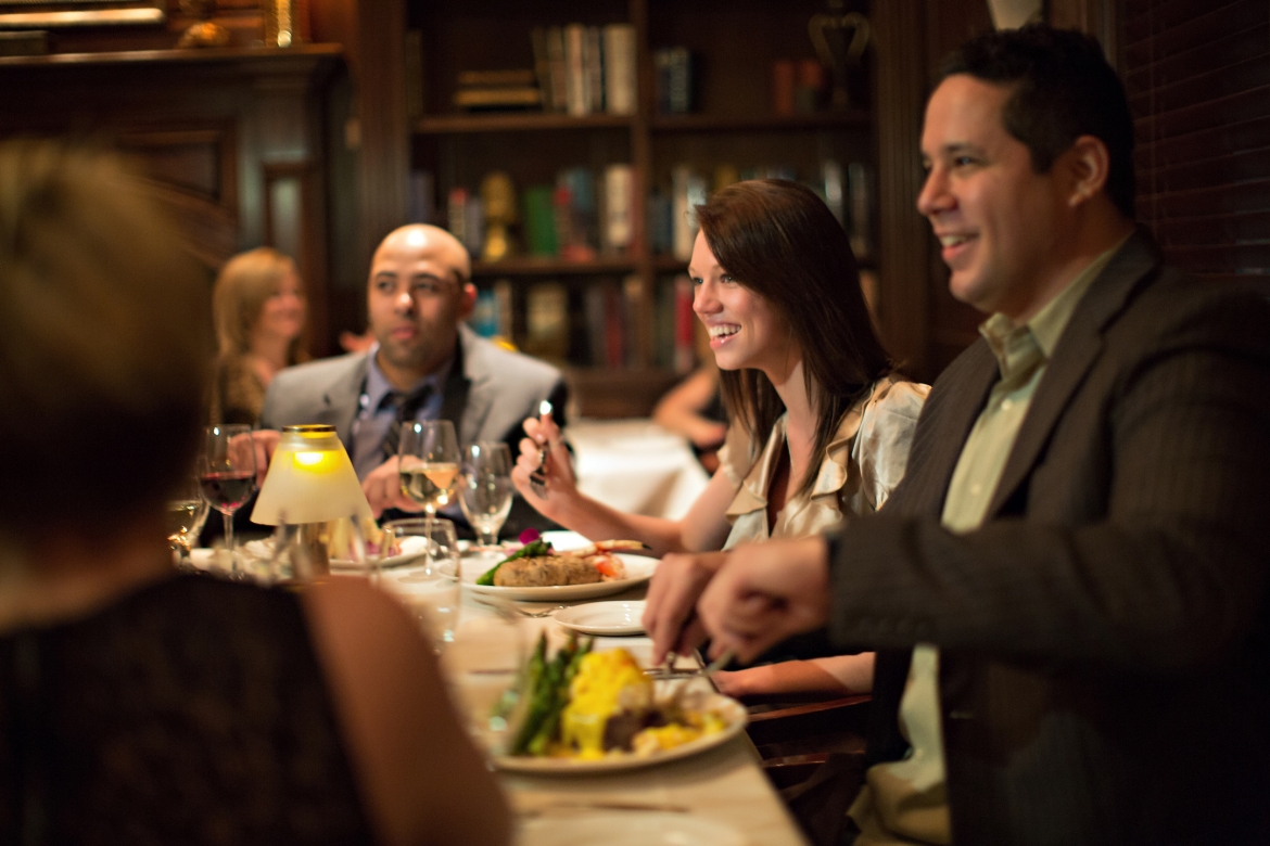 People enjoying food at a wedding reception